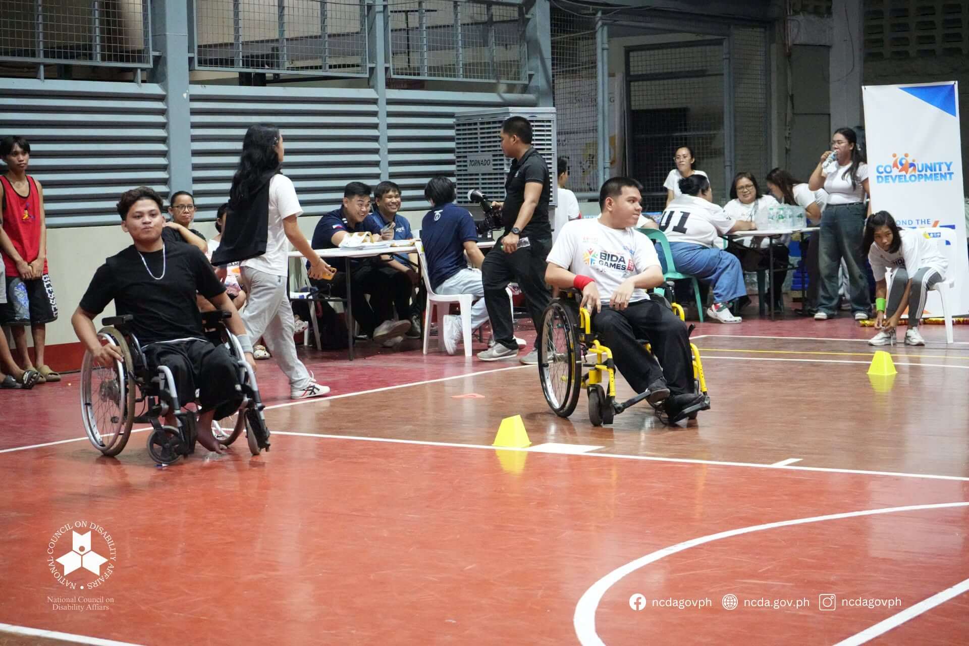Athletes racing in wheelchairs at BIDA Games 2026, showcasing competitive para-sports in Las Piñas